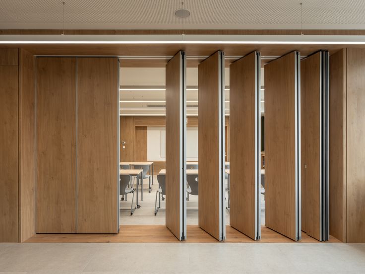 Movable acoustic partition door systems